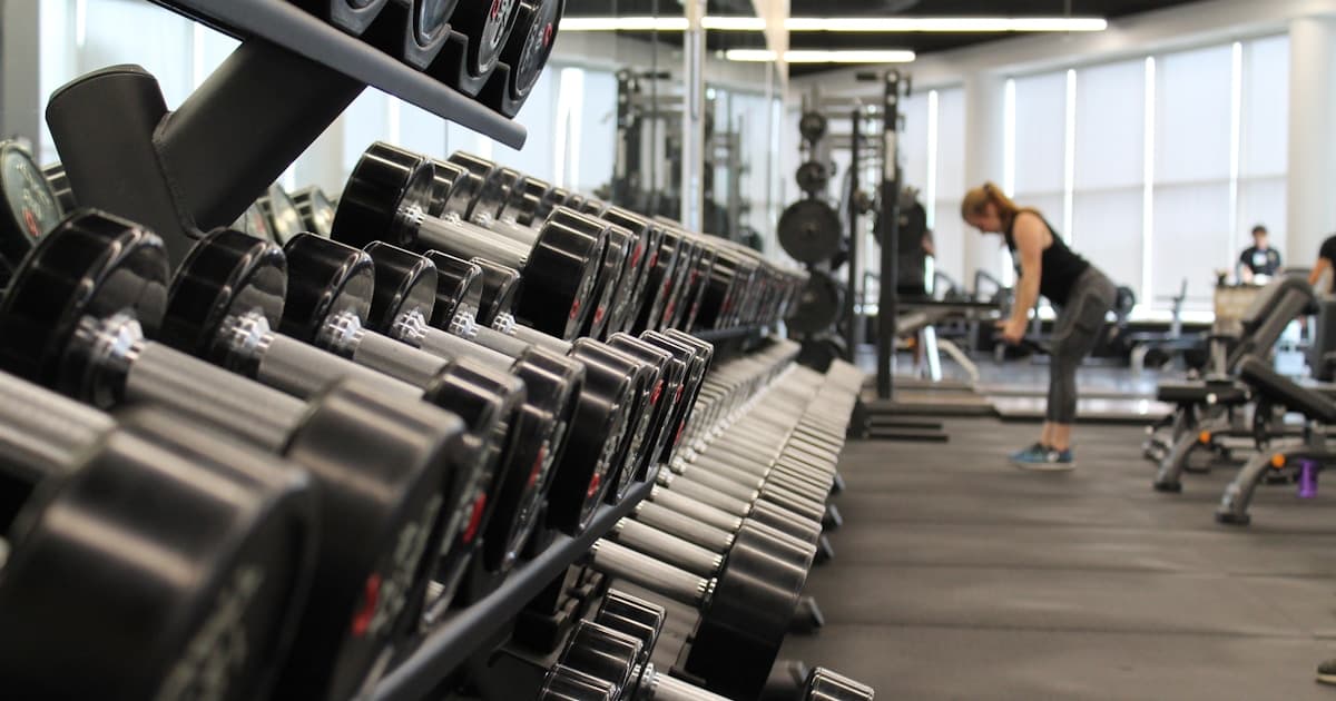 Gym members working out together in a modern fitness facility